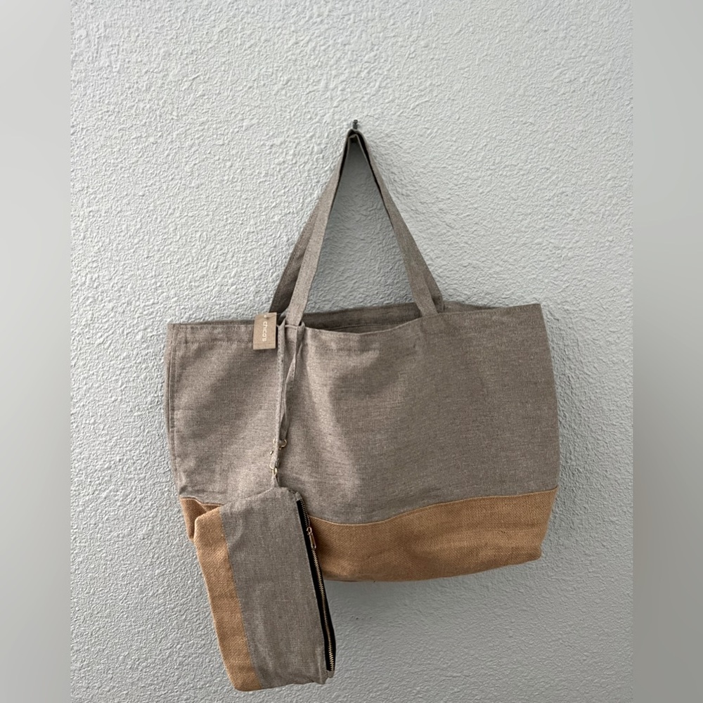 NWT Chico’s tote with matching wristlet. Silver with camel trim.